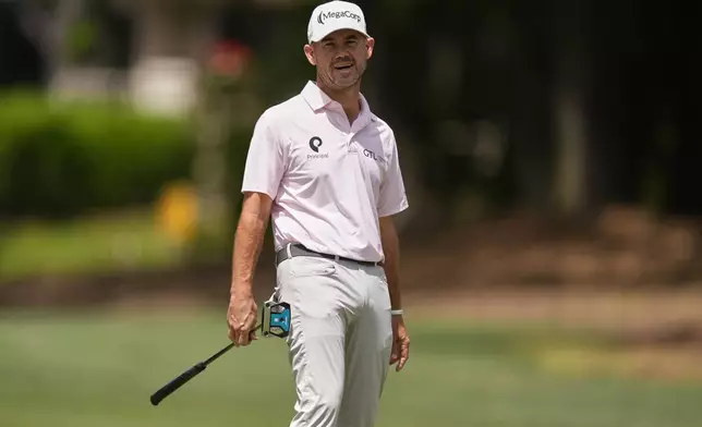 Brian Harman reacts after hitting a putt on the second hole during the final round of the RBC Heritage golf tournament, Sunday, April 20, 2025, in Hilton Head Island, S.C. (AP Photo/Mike Stewart)