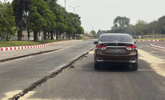 A car makes its way through a road damaged in the aftermath of the March 28 earthquake in Naypyitaw, Myanmar, Thursday, April 10, 2025. (AP Photo)