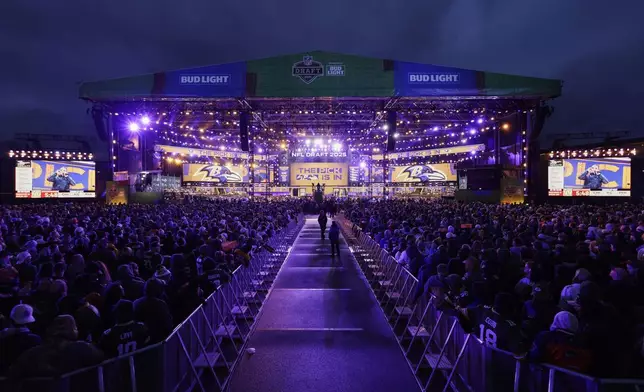 Fans watch during the second round of the NFL football draft, Friday, April 25, 2025, in Green Bay, Wis. (AP Photo/Matt Ludtke)