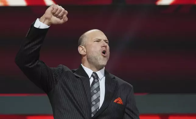 Former player Joe Thomas cheers before announcing a by the Cleveland Browns during the second round of the NFL football draft, Friday, April 25, 2025, in Green Bay, Wis. (AP Photo/Jeff Roberson)