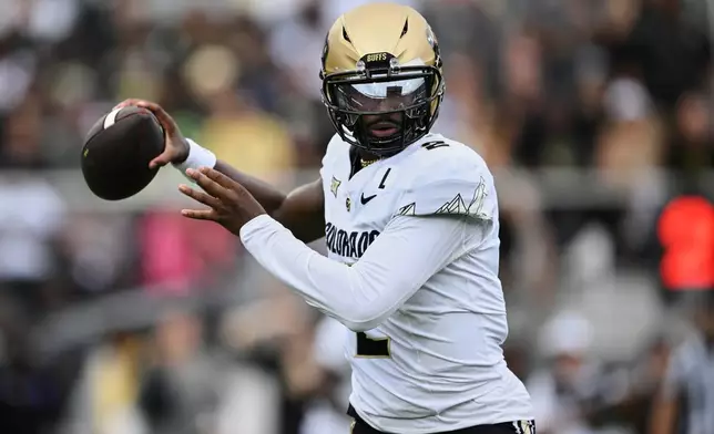 FILE - Colorado quarterback Shedeur Sanders (2) throws a pass against Central Florida during the first half of an NCAA college football game, Saturday, Sept. 28, 2024, in Orlando, Fla. (AP Photo/Phelan M. Ebenhack, File)