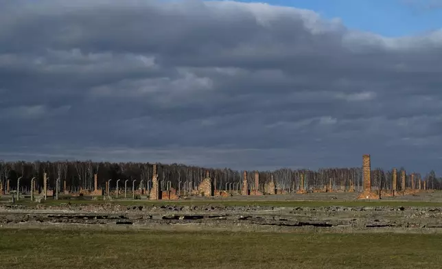 FILE — The remains of brick stone chimneys of prisoners barracks inside the former Nazi death camp of Auschwitz Birkenau or Auschwitz II. in Oswiecim, Poland, Dec. 8, 2019. (AP Photo/Markus Schreiber, File)