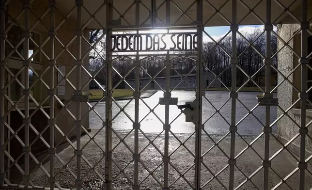 A view of the entrance gate of the Nazi death camp 'Buchenwald' with the inscription 'Jedem das Seine' (To Each His Own) in Weimar, Germany, on Jan. 10, 2020. (AP Photo/Markus Schreiber)