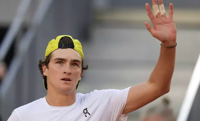 Joao Fonseca of Brazil celebrates after defeating Elmer Moeller of Denmark during the Madrid Open tennis tournament in Madrid, Spain, Thursday, April 24, 2025. (AP Photo/Manu Fernandez)