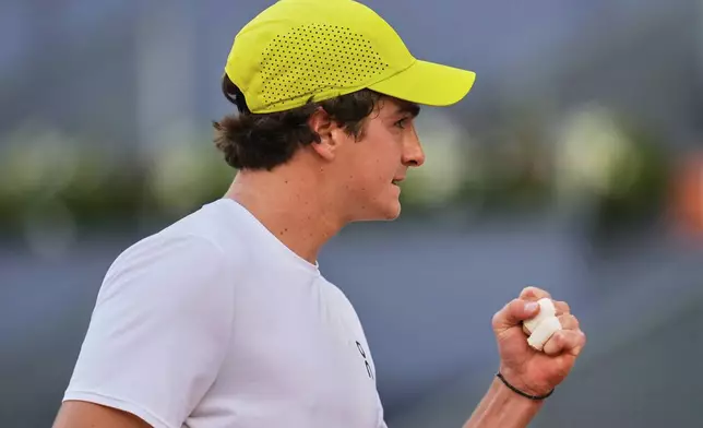Joao Fonseca of Brazil celebrates a point against Elmer Moeller of Denmark during the Madrid Open tennis tournament in Madrid, Spain, Thursday, April 24, 2025. (AP Photo/Manu Fernandez)