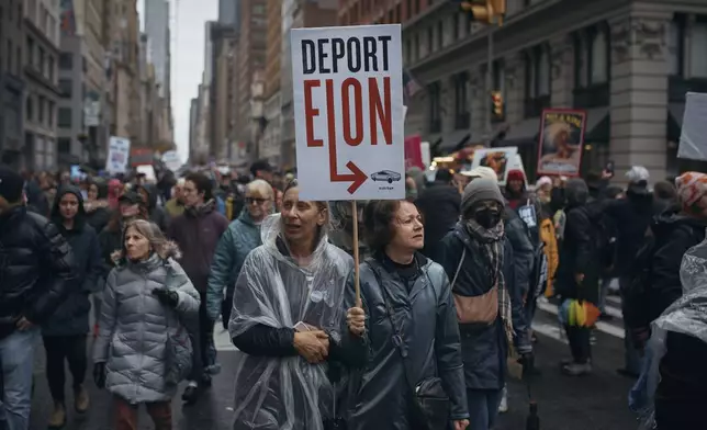 Demonstrators march during a "Hands Off!" protest against President Donald Trump on Saturday, April 5, 2025, in New York. (AP Photo/Andres Kudacki)