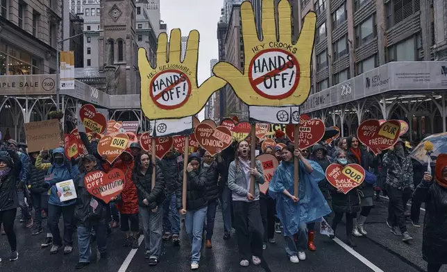 Protestors shout slogans as they take to the streets and march during a "Hands Off!" protest against President Donald Trump on Saturday, April 5, 2025, in New York. (AP Photo/Andres Kudacki)