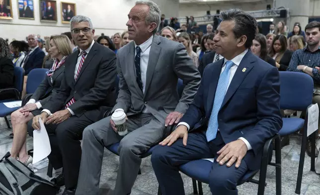 From left, Director of the National Institutes of Health Jay Bhattacharya, Health and Human Services Secretary Robert F. Kennedy Jr. and Food and Drug Administration (FDA) commissioner Marty Makary, during a news conference on the FDA's intent to phase out the use of petroleum-based synthetic dyes in the nation's food supply at the Hubert Humphrey Building Auditorium in Washington, Tuesday, April 22, 2025. (AP Photo/Jose Luis Magana)