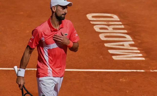 Novak Djokovic of Serbia competes against Matteo Arnaldi of Italy at the Madrid Open tennis tournament in Madrid, Spain, Saturday, April 26, 2025. (AP Photo/Manu Fernandez)