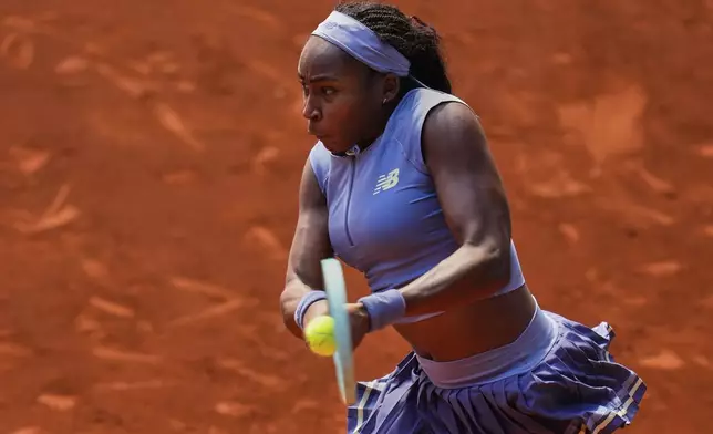 United States' Coco Gauff returns the ball against United States' Ann Li during the Madrid Open tennis tournament in Madrid, Spain, Saturday, April 26, 2025. (AP Photo/Manu Fernandez)