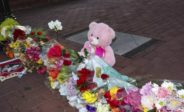 An impromptu memorial of flowers and other items laid near the center of the Florida State campus in sight of the Student Union building, Tallahassee, Fla., Thursday, April 17, 2025. (AP Photo/Gary McCullough)