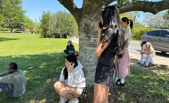 Florida State University students wait for news amid an active shooter incident at the school’s campus in Tallahassee, Fla., Thursday, April 17, 2025 (AP Photo/Kate Payne)