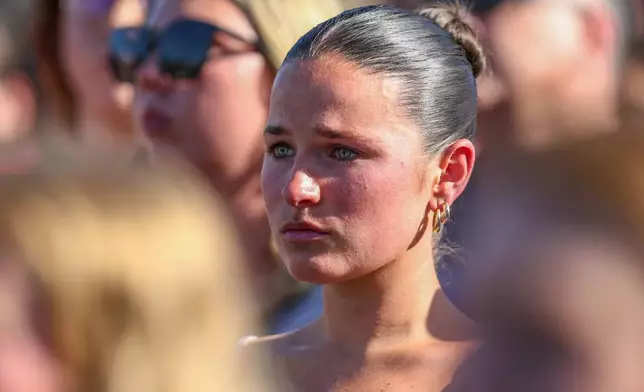 A student mourns during a vigil on the Florida State campus at Langford Green, Tallahassee, Fla., Friday, April 18, 2025. (AP Photo/Gary McCullough)