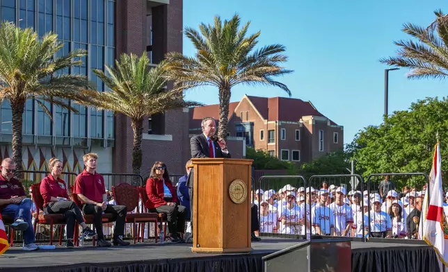 The day after an active shooter on campus Florida State president Richard McCullough addresses a vigil on campus at Langford Green, Tallahassee, Fla., Friday, April 18, 2025. (AP Photo/Gary McCullough)