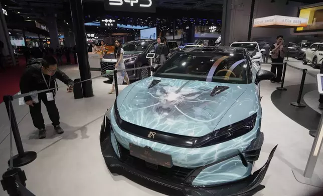 A BYD Han L car model inspired by Black Myth: Wukong is displayed at the Auto Show in Shanghai, Wednesday, April 23, 2025. (AP Photo/Ng Han Guan)