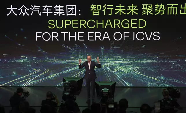 Ralf Brandstatter, Chairman and CEO of Volkswagen Group China, speaks during the media night ahead of the Auto Show in Shanghai, Tuesday, April 22, 2025. (AP Photo/Ng Han Guan)