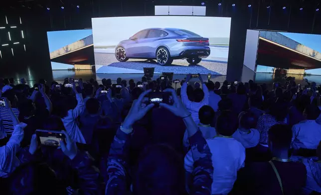 The ID Aura concept car is shown during the Volkswagen Group media night ahead of the Auto Show in Shanghai, Tuesday, April 22, 2025. (AP Photo/Ng Han Guan)
