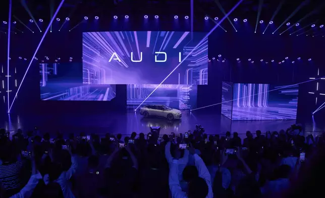 The Audi E5 Sportback is launched during the Volkswagen Group media night ahead of the Auto Show in Shanghai, Tuesday, April 22, 2025. (AP Photo/Ng Han Guan)
