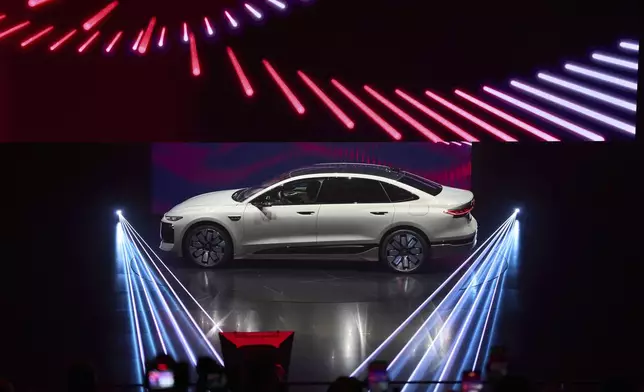 The A6L-etron is launched during the Volkswagen Group media night ahead of the Auto Show in Shanghai, Tuesday, April 22, 2025. (AP Photo/Ng Han Guan)