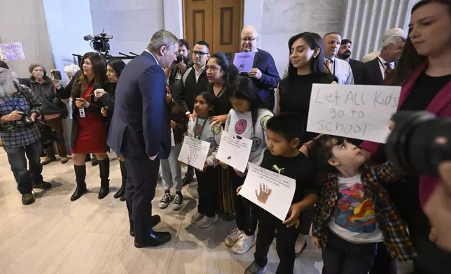 Democtratic Sen. Jeff Yarbro, of Nashville, talks to a group protesting an immigration bill outside the Senate chamber at the state Capitol Thursday, April 10, 2025 in Nashville, Tenn. (AP Photo/John Amis)