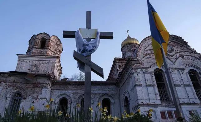 A church destroyed in fighting between Russian and Ukrainian forces is seen during celebration of the Orthodox Easter in Lukashivka village, Ukraine, on Sunday, April 20, 2025. (AP Photo/Evgeniy Maloletka)