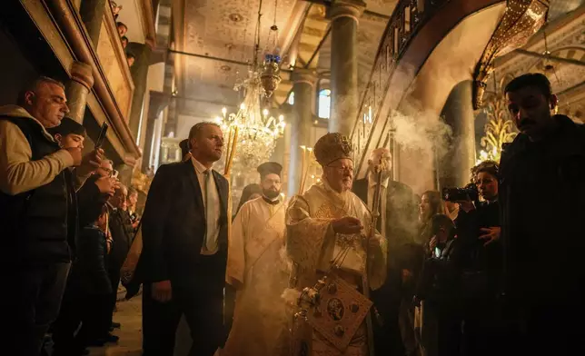 Ecumenical Patriarch Bartholomew I, the spiritual leader of the world's Eastern Orthodox Christians, leads the Easter Sunday Resurrection liturgy, marking the end of the Holy Week at the Patriarchal Church of St. George in Istanbul, Turkey, Sunday, April 20, 2025. (AP Photo/Emrah Gurel)