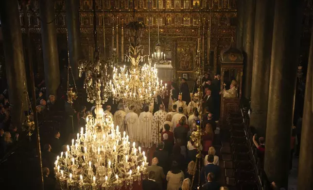 Ecumenical Patriarch Bartholomew I, right, the spiritual leader of the world's Eastern Orthodox Christians, leads the Easter Sunday Resurrection liturgy, marking the end of the Holy Week at the Patriarchal Church of St. George in Istanbul, Turkey, Sunday, April 20, 2025. (AP Photo/Emrah Gurel)