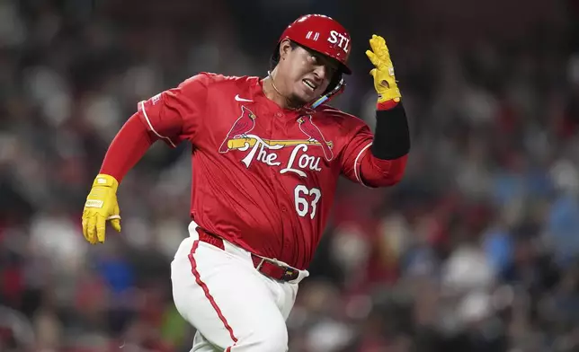 St. Louis Cardinals' Yohel Pozo rounds first on his way to an RBI double during the fifth inning of a baseball game against the Philadelphia Phillies Friday, April 11, 2025, in St. Louis. (AP Photo/Jeff Roberson)