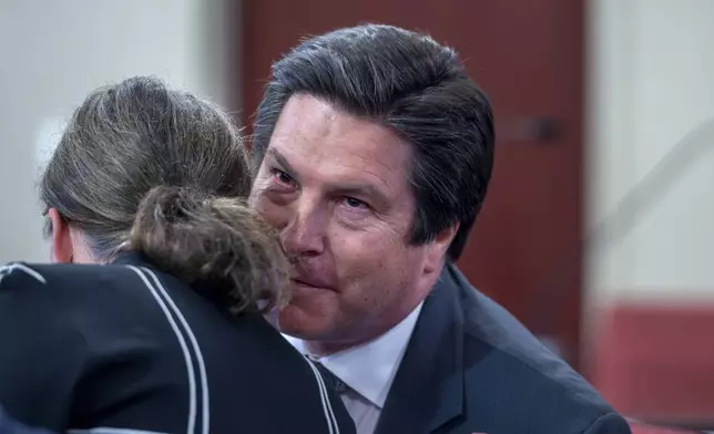 Attorney Kurt Sommer talks with his client Julia Peters, who is representing the estate of actor Gene Hackman and his wife Betsy Arakawa Hackman, in a case regarding the release of public records in First District Court, Monday, March 31, 2025, in Santa Fe, N.M. (Eddie Moore/The Albuquerque Journal via AP)