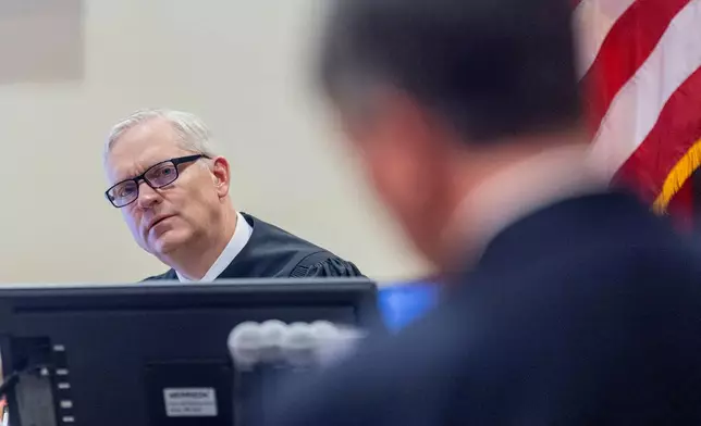 Judge Matthew J. Wilson listens to arguments by attorney Greg Williams, representing the media interveners in the Gene Hackman and his wife, Betsy Arakawa case, regarding the release of public records in District Court in Santa Fe, N.M., Monday, March 31, 2025. (Michael G. Seamans/Santa Fe New Mexican via AP, Pool)