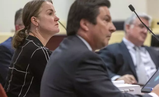 Julia Peters, left, Hackman family estate representative sits with attorney, Kurt Sommer, before Judge Matthew J. Wilson in a court hearing on the release of public records in District Court in Santa Fe, N.M., on Monday, March 31, 2025. (Michael G. Seamans/Santa Fe New Mexican via AP, Pool)