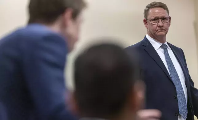 Gary Coffin, co-council for the Hackman estate, looks to Santa Fe County attorney, Walker Boyd, left, and and Peter Valencia, center, during witness testimony in the Hackman estate privacy case before Judge Matthew J. Wilson in District Court in Santa Fe, N.M., Monday, March 31, 2025. (Michael G. Seamans/Santa Fe New Mexican via AP, Pool)
