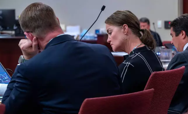 Julia Peters, center, representing the estate of actor Gene Hackman and his wife Betsy Arakawa Hackman, sits in First District Court with her attorneys during arguments for an injunction to prevent the release of photos and other evidence related to the death of the Hackmans last month, in Santa Fe, N.M., Monday, March 31, 2025. (Eddie Moore/The Albuquerque Journal via AP)