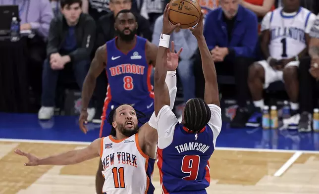 New York Knicks guard Jalen Brunson (11) defends Detroit Pistons forward Ausar Thompson (9) in the second half during Game 5 in an NBA basketball first-round playoff series Tuesday, April 29, 2025, in New York. (AP Photo/Adam Hunger)