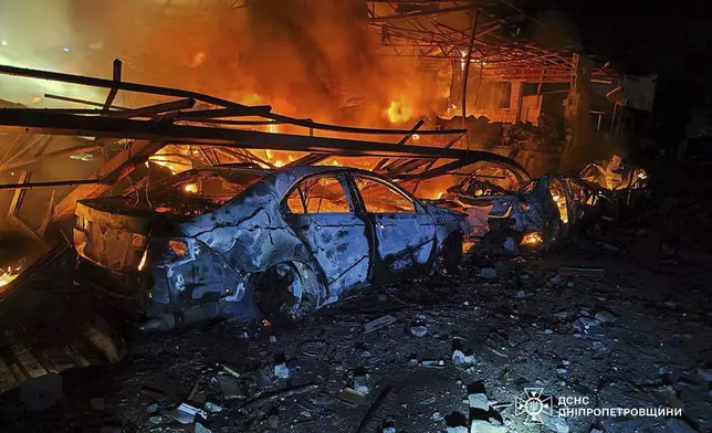 In this photo provided by the Ukrainian Emergency Service, firefighters put out the fire following Russia's drones attack in Kamianske, Dnipropetrovsk region, Ukraine, Wednesday, April 16, 2025. (Ukrainian Emergency Service via AP)