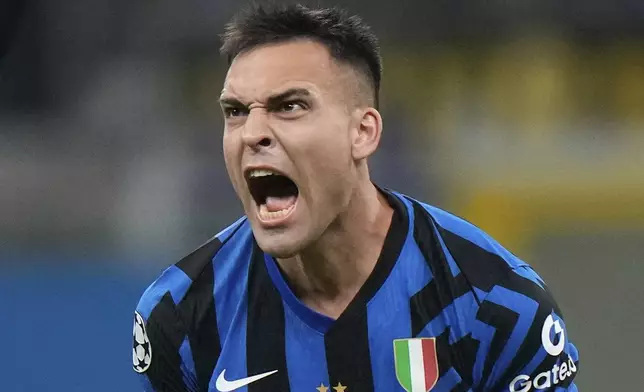 Inter Milan's Lautaro Martinez celebrates at the end of the Champions League quarterfinal second leg soccer match between Inter Milan and Bayern Munich at the San Siro stadium in Milan, Italy, Wednesday, April 16, 2025. (AP Photo/Luca Bruno)