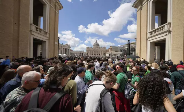 People line up to enter St. Peter's Square at the Vatican, Friday April 25, 2025. (AP Photo/Luca Bruno)