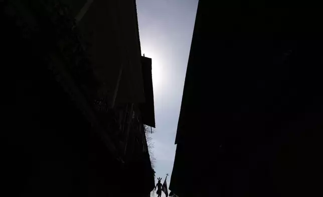 Catholics carry a statue of Jesus Christ during an Easter procession in Panama City's Casco Viejo, Sunday, April 20, 2025. (AP Photo/Matias Delacroix)