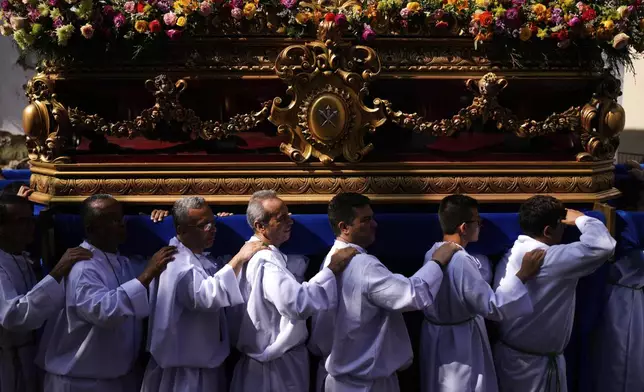 Catholics carry a statue of Jesus Christ during an Easter procession in Panama City's Casco Viejo, Sunday, April 20, 2025. (AP Photo/Matias Delacroix)
