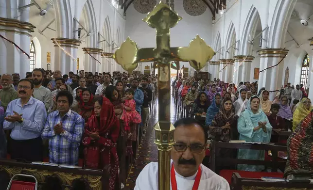 Christians attend an Easter Mass at the St. John's Cathedral, in Peshawar, Pakistan, Sunday, April 20, 2025. (AP Photo/Muhammad Sajjad)
