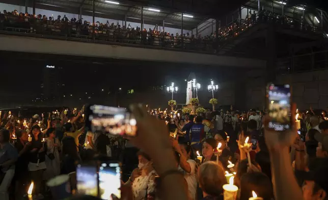 Catholic devotees join a procession during Easter Sunday rites at the St. Peter Chapels in Quezon City, Philippines, on Sunday. April 20, 2025. (AP Photo/Basilio Sepe)