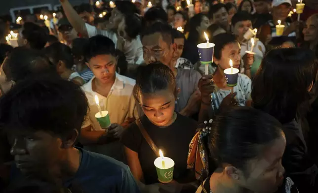 Filipino Catholic devotees light candles during Easter Sunday rites at the St. Peter Chapels in Quezon City, Philippines, Sunday, April 20, 2025. (AP Photo/Basilio Sepe)