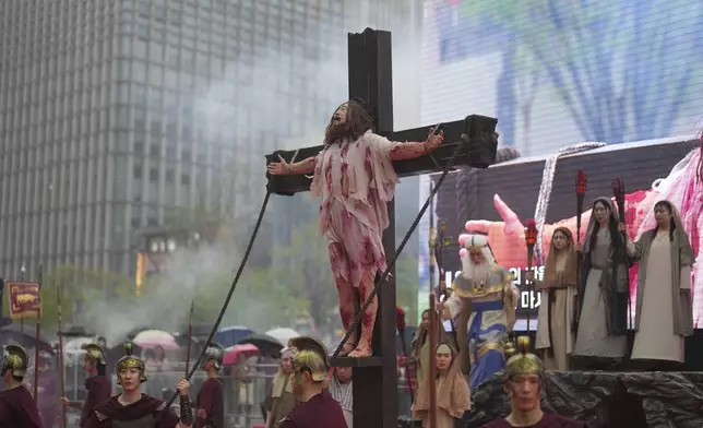 Performers reenact during the Easter parade in Seoul, South Korea, Saturday, April 19, 2025. (AP Photo/Lee Jin-man)