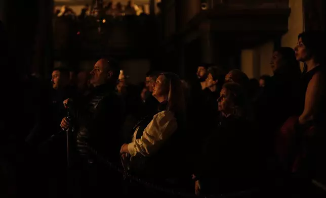 Worshippers attend Easter Vigil mass at the Patriarchal Church of St. George in Istanbul, Turkey, Sunday, April 20, 2025. (AP Photo/Khalil Hamra)