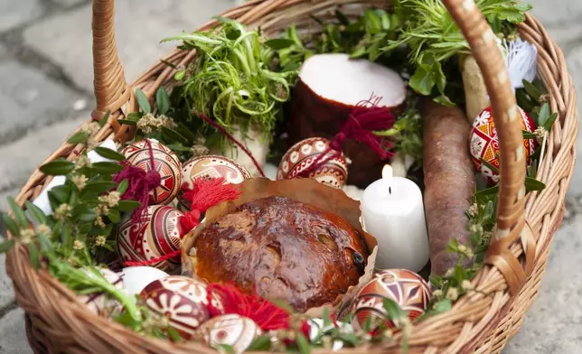 Easter baskets are seen during celebration of the Orthodox Easter in Lviv, Ukraine, April 19, 2025. (AP Photo/Mykola Tys)