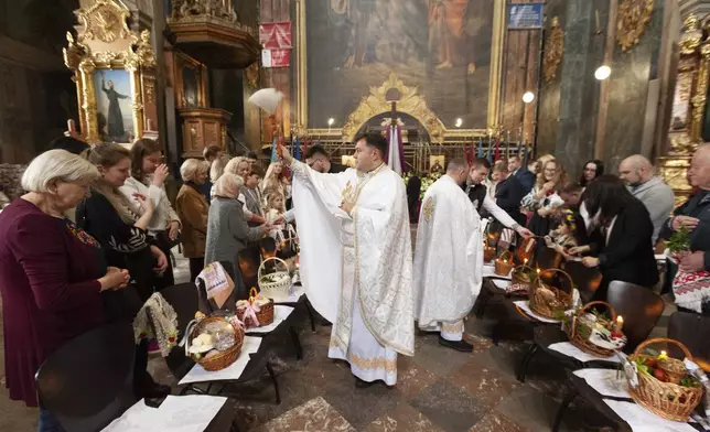 Priests bless Easter baskets during celebration of the Orthodox Easter in Lviv, Ukraine, April 19, 2025. (AP Photo/Mykola Tys)