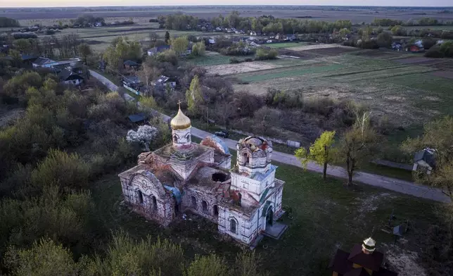 A church destroyed in fighting between Russian and Ukrainian forces is seen from above during celebration of the Orthodox Easter in Lukashivka village, Ukraine, on Sunday, April 20, 2025. (AP Photo/Evgeniy Maloletka)