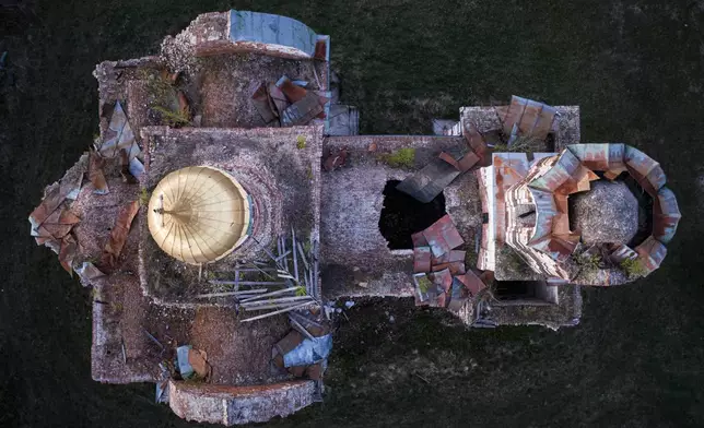 A church destroyed in fighting between Russian and Ukrainian forces is seen from above during celebration of the Orthodox Easter in Lukashivka village, Ukraine, on Sunday, April 20, 2025. (AP Photo/Evgeniy Maloletka)