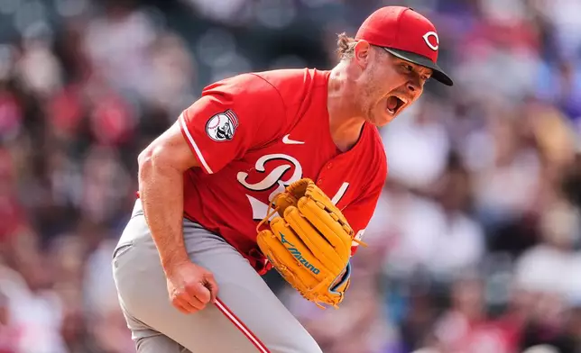 Cincinnati Reds relief pitcher Emilio Pagán reacts after striking out Colorado Rockies' Brenton Doyle to end a baseball game Saturday, April 26, 2025, in Denver. (AP Photo/David Zalubowski)