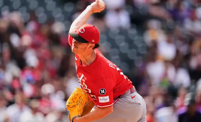 Cincinnati Reds relief pitcher Emilio Pagán works against the Colorado Rockies in the ninth inning of a baseball game Saturday, April 26, 2025, in Denver. (AP Photo/David Zalubowski)